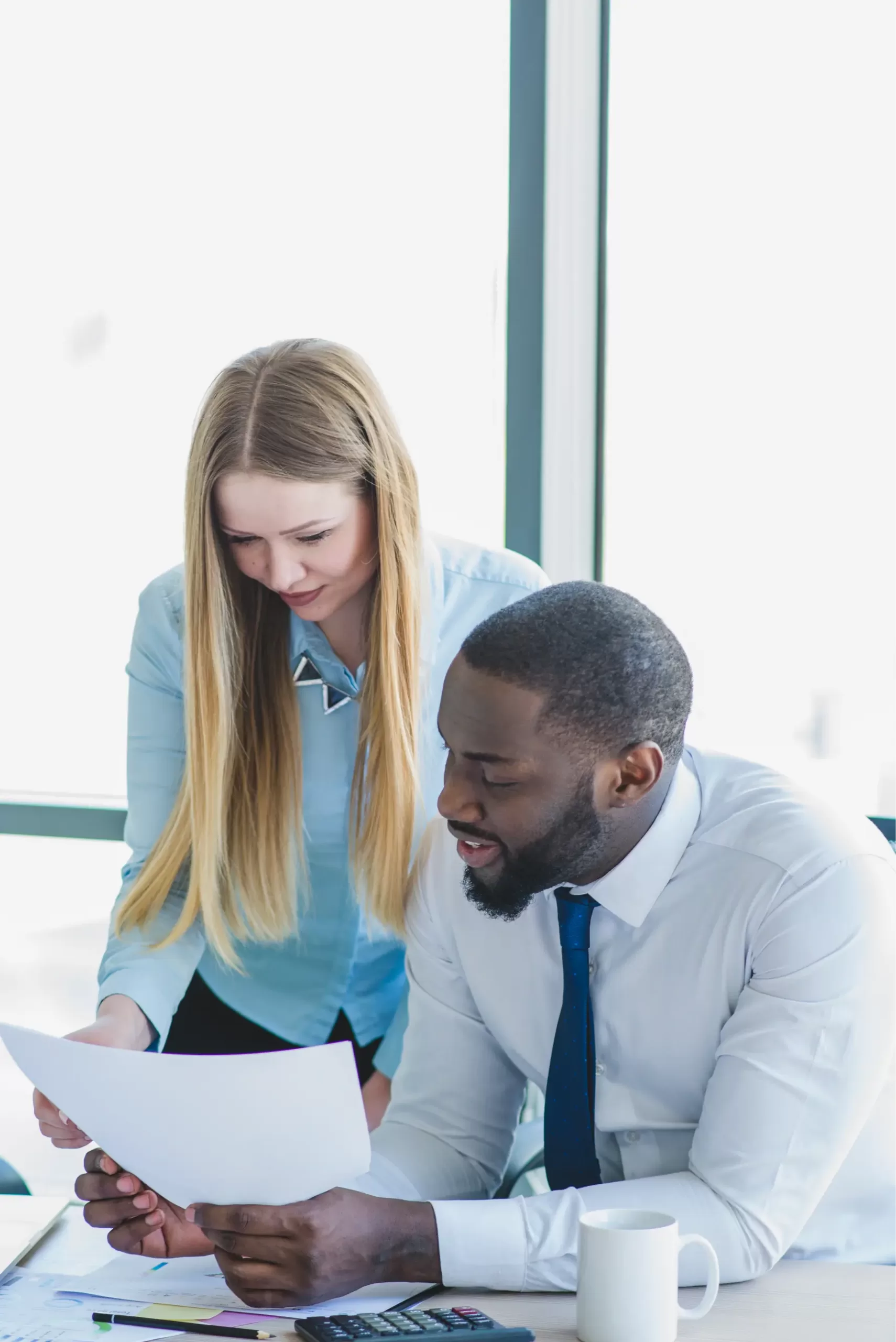 man-woman-reading-business-paper